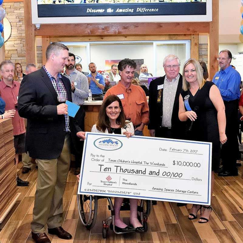 Amazing Spaces Grand Opening Presenting TCH with Check | Raising $10,000 for Texas Children’s Hospital The Woodlands | Amazing Spaces Storage Centers