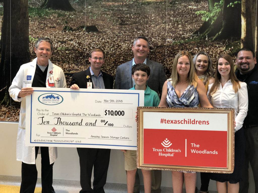 Amazing Spaces Delivers Check | Amazing Spaces® Storage Centers Raises $10,000 for Texas Children’s Hospital The Woodlands and Celebrates the Grand Opening of its 6th Location | Amazing Spaces Storage Centers